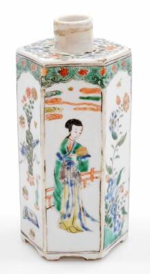 A Chinese porcelain hexagonal tea caddy, decorated with panels of vases and figures beside a fence, decorated in famille verte palette, unglazed base, 18thC, 18cm high.