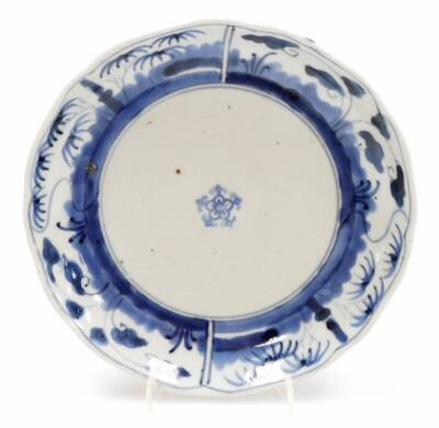 A pair of Japanese porcelain blue and white plates, with central floral emblems and outer panels of bamboo and lotus, the reverse with Fuki Choshun mark, 19thC,18cm wide. (AF) - 2