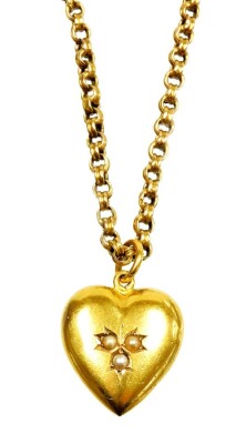 A heart shaped pendant and chain, the heart shaped pendant set with three seed pearls to centre, on single loop drop, marked to back 15c, marked AW, on rounded box link yellow metal chain, marked 375, 46cm long overall, 8.9g all in.