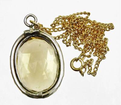 A silver framed citrine pendant and chain, the oval pendant in a florally engraved oval silver frame, 3cm x 2.5cm, on a gold plated chain. - 2