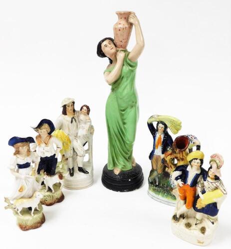 Various Staffordshire figures, to include a 19thC flat back spill vase of farmers, one holding wheat, predominately in blue, orange and yellow, 26cm high, a pair of Continental figures, further Staffordshire flat back farm group, and a plaster figure of a