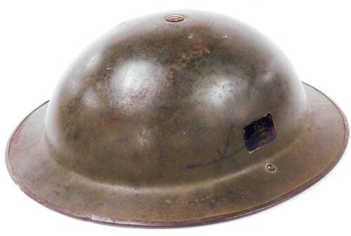 A mid 20thC fire helmet, probably a post WWII Belgian Tommy Brody clone with Belgian flag to interior 32cm x 29cm.