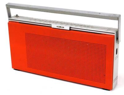 A vintage Bang & Olufsen BZ19 radio, in orange and chrome colours, with swing handle, 35cm wide.