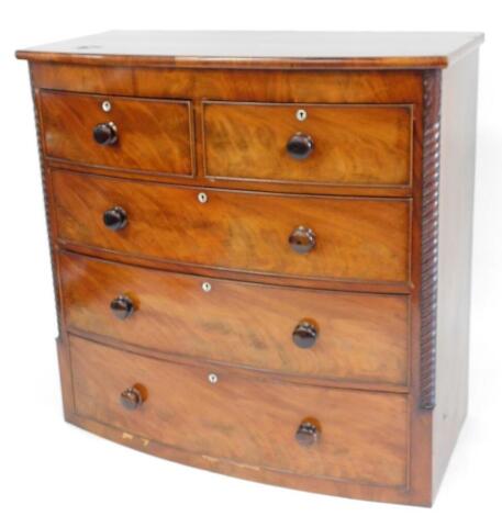 A 19thC mahogany bow front chest, of two short and three long cock beaded drawers, with mother of pearl escutcheons, flanked by quarter scroll columns, 109cm high, 109cm wide, 53cm deep.
