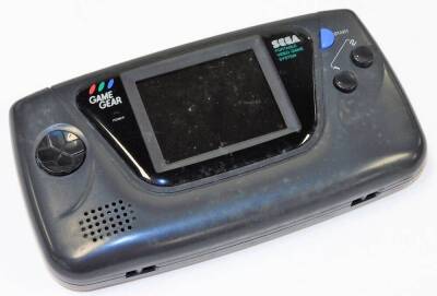 A boxed Sega Game Gear games console, with boxed AC adapter, quantity of games in outer game gear plastic boxes, to include World Class Leader Board Golf, Shinobi, Sonic The Hedgehog, Mickey Mouse Castle of Illusion, etc. (a quantity) - 2