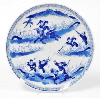 A 19thC Chinese porcelain plate, profusely hand decorated with warriors before mountains, 24cm diameter.