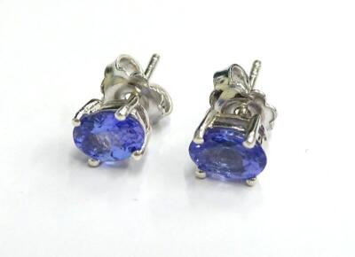 A pair of tanzanite stud earrings, each with butterfly backs, silver, 3.4g all in.