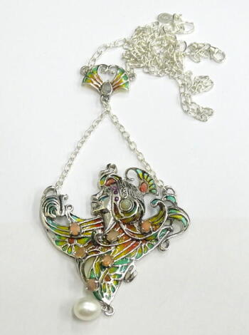 A plique-a-jour necklace, depicting a woman set with opals, rubies and marcasite, white metal, marked 925, 21.6g all in.