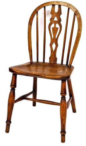 Taylor (Grantham). A 19thC ash and elm hoop back side chair of small proportions, with pierced back splat, and turned vertical rails, shaped seat and single ring turned front legs, joined by H stretcher, stamped to the seat, 82cm high.