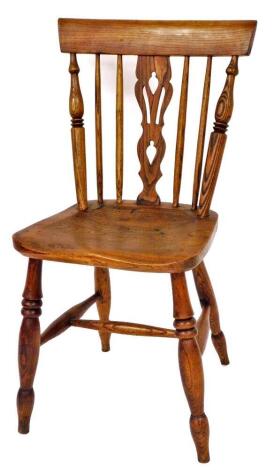 A 19thC ash and elm side chair, with block cresting rail, pierced back splat, turned rail, shaped seat and double ring turned front legs joined by a H stretcher, similar design to the previous lot, 85cm high.