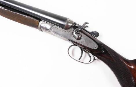 An English double barrel 12 gauge side by side shotgun, SN 11689.