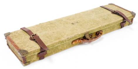 A Brady style canvas brass and leather bound gun case.