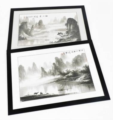 20thC Chinese. A pair of mountainous river scenes, with figures, boats and cattle, monochrome watercolours, signed, 44cm x 66cm.