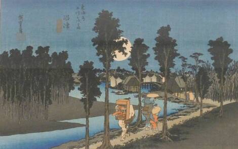 A Japanese woodblock print titled Dusk Scene in Numazu, first created by Utagawa Hiroshige (1797-1858) between 1831 and 1834. No. 13 from the series - 53 Stations of the Tôkaidô. 24cm x 37cm.