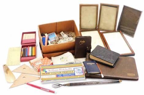 A quantity of trinket frames and measuring equipment, to include cross stitch patterns, tape measures, threads, pins, needles, coloured pencils, stationary, miniature address box, photograph albums, various photograph frames, etc. (1 box)