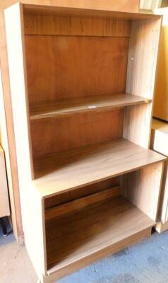 A modern beech effect display unit, the upper section with single shelf and cupboard base, lacking doors, 147cm high, 80cm wide, 46cm deep.