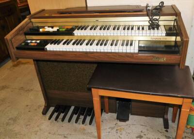 A Hohner Symphonie D92 electric organ, with stool.