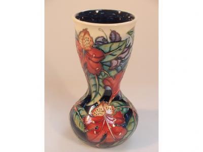 A Moorcroft waisted vase decorated with lilies