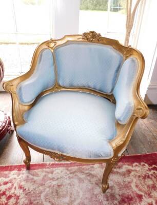 A pair of Louis XV style French gilt wood and gesso fauteuils, each with a moulded show frame, carved with scrolls, shell, etc., upholstered in blue patterned fabric, on cabriole legs and a Louis XV style French rectangular stool, with a padded seat uphol - 2