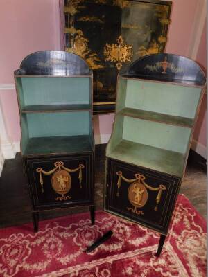 A pair of George III painted waterfall side cabinets, on a black ground, each with a raised top above two shelves, the base with a panelled door, carved with a putto, swags, ribbons, etc., on slender square tapering legs, 127cm high, 48cm wide, 27cm deep. - 3