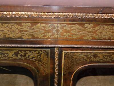 A late 19thC ebonised and brass inlaid side cabinet, with gilt metal mounts, the plain top above a leaf cast frieze, above two glazed doors enclosing a velvet lined interior, on a plinth base, 116cm high, 97cm wide, 32cm deep. - 4