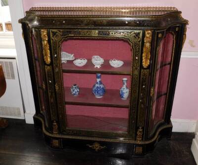 A Victorian Boulle and ebonised credenza, with a pierced gilt gallery, a concave frieze decorated with putti picked out in ivory, etc., enclosing a velvet lined interior, flanked by two further serpentine shaped doors, on a plinth base, 127cm high, 142cm - 3