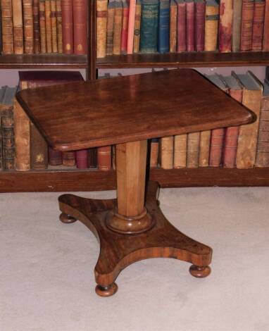 A 19thC mahogany occasional table, the rectangular top with rounded corners on an octagonal tapering column and quatrefoil base with ceramic castors, label to underside for Richardson & Sons Manufacturers Bond Street, dated 1864, adapted, 53cm high, 60cm 