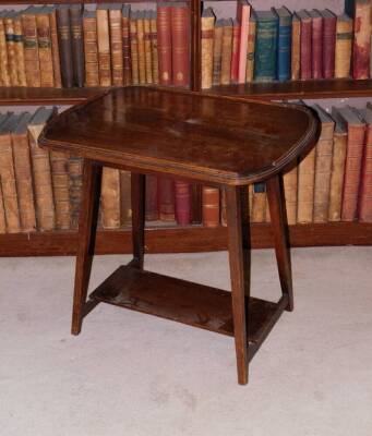 An early 20thC oak occasional table, the top with a raised gallery, on square tapering legs, with undertier, 56cm high, 58cm wide.