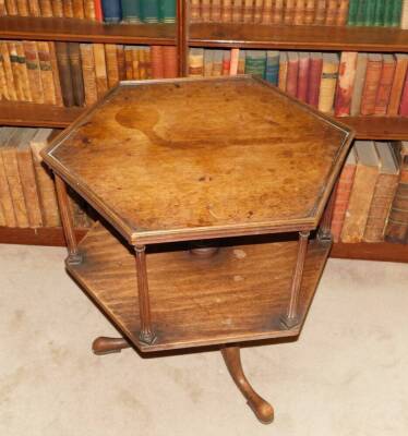 A mahogany revolving bookcase, the hexagonal top with a raised moulded gallery on reeded column supports, on a turned column and tripod base, with pad feet, constructed using old timber, 73cm high, 70cm wide. - 2