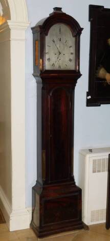 Barraud of Cornhill, London. A George III mahogany longcase clock, the arched silver dial with strike silent and Roman numerals, eight day four pillar movement, in mahogany case with arched hood, canted reeded corners and pierced sides, lacking fret work,