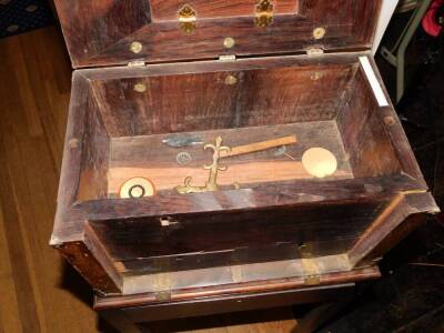 A French 17thC Kingwood Coffre Forte, with brass Gothic style straps, the hinged lid enclosing a vacant lignum veneered interior, the fall front enclosing two secret drawers, on a associated George II mahogany stand with frieze drawer on chamfered legs, 1 - 3