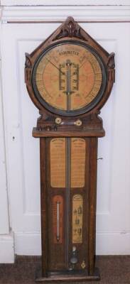 A late 19thC Royal Polytechnic Admiral Fitzroy barometer, in a shaped case, the circular dial with various settings, label for Joseph Davies & Co Sole Manufacturers London, 103cm high.