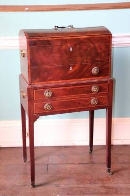 An early 19thC mahogany chest, the domed rosewood crossbanded top, with a brass handle, enclosing a vacant interior, above a frieze drawer with ivory escutcheon and brass ring handles, the base with a deep double frieze drawer with matching handles on squ