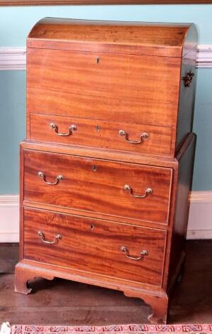 An early 19thC dome top mahogany chest, with brass handles and a frieze drawer, on a two drawer base on bracket feet, 109cm high, 59cm wide, 39cm deep.