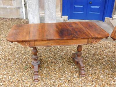 A pair of William IV rosewood sofa tables, each rectangular top with rounded corners above a frieze drawer and a beaded edge, on turned beaded end supports with rectangular platform and scroll carved feet, 73cm high, the top 138cm wide, 71cm deep. - 6