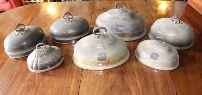 Six various 19thC silver plated meat covers, some with crests.