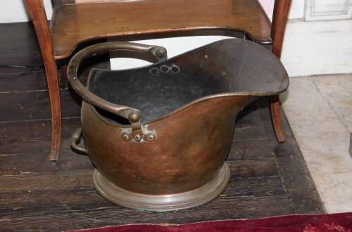 A Victorian copper coal helmet, 50cm.