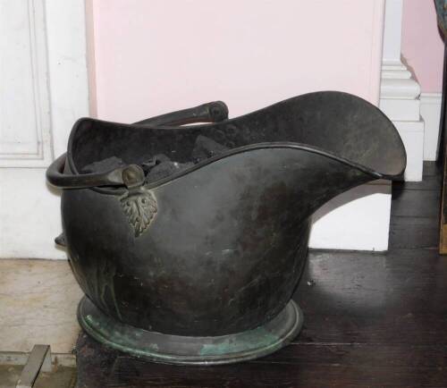 A Victorian copper coal helmet, 52cm.