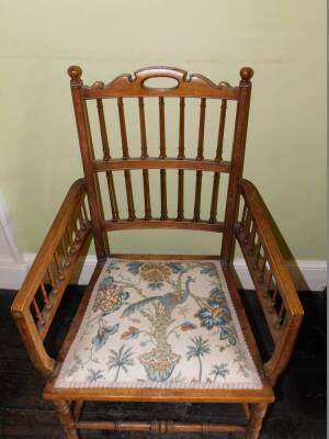 A Edwardian walnut open armchair, with fine spindle turned supports, a padded seat and splayed legs. - 2