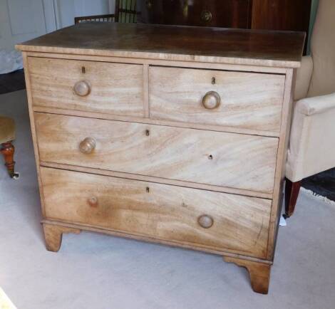 A 19thC mahogany chest of drawers, with a plain top above two short and two long drawers, with turned wooden handles on bracket feet, 88cm high, 95cm wide, 54cm deep.