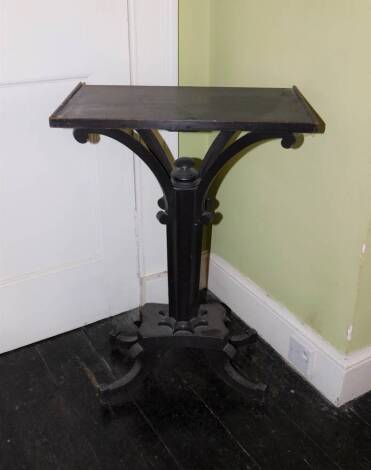 A 19thC ebonised stand, the rectangular top with a raised border on a octagonal concave column with splayed supports, a platform base with splayed feet, 74cm high, 49cm wide, 29cm deep.