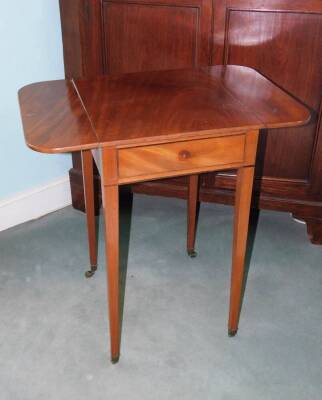 A Victorian mahogany Pembroke table, the rectangular top above an ebony strung frieze drawer, on square tapering legs with brass castors, 74cm high, 69cm wide.