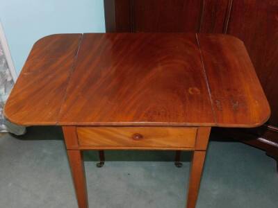 A Victorian mahogany Pembroke table, the rectangular top above an ebony strung frieze drawer, on square tapering legs with brass castors, 74cm high, 69cm wide. - 2