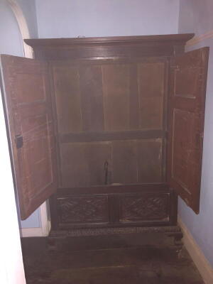 A 17thC and later carved oak two-door cupboard, with moulded cornice, two carved panel doors revealing a full length hanging interior over a two panel base, on ogee bracket feet, 182cm high, 126cm wide, 53cm deep. - 3