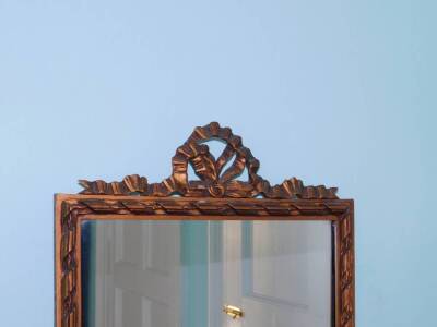 A rectangular gilt wall mirror, the frame decorated with ribbons, etc., 134cm high, 34cm wide. - 2