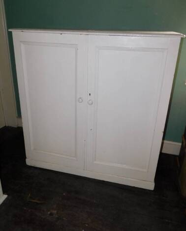 A Victorian painted pine two door press cupboard, 126cm high, 124cm wide, 54cm deep.