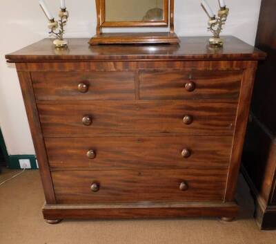 A Victorian mahogany chest, of two short and three long graduated drawers with knop handles, plinth and flattened bun feet, 105cm high, 123cm wide, 56cm deep.