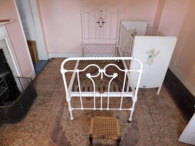 A Victorian brass and cast iron single bed, a transfer printed cot by Marmet, stool, fender, carpet square, etc. (the entire contents of bedroom 5)