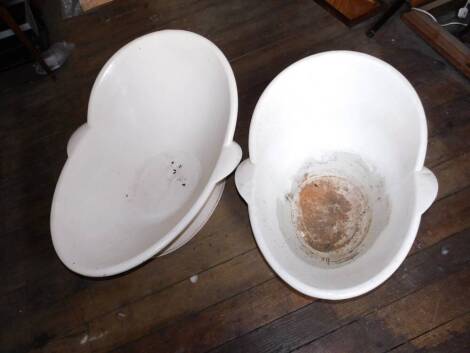 Two graduated Victorian tin hip baths, 100cm and 80cm.