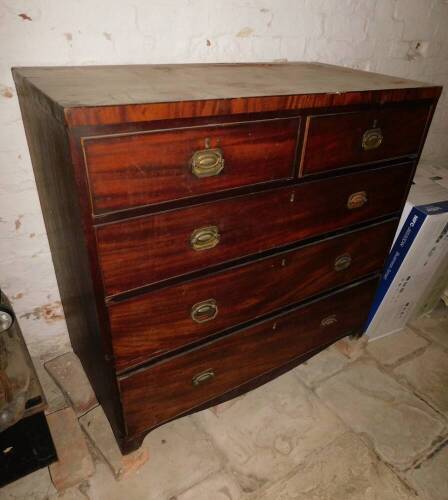 An early 19thC mahogany chest, of two short and three long graduated drawers, with brass handles, 109cm wide, 55cm deep.